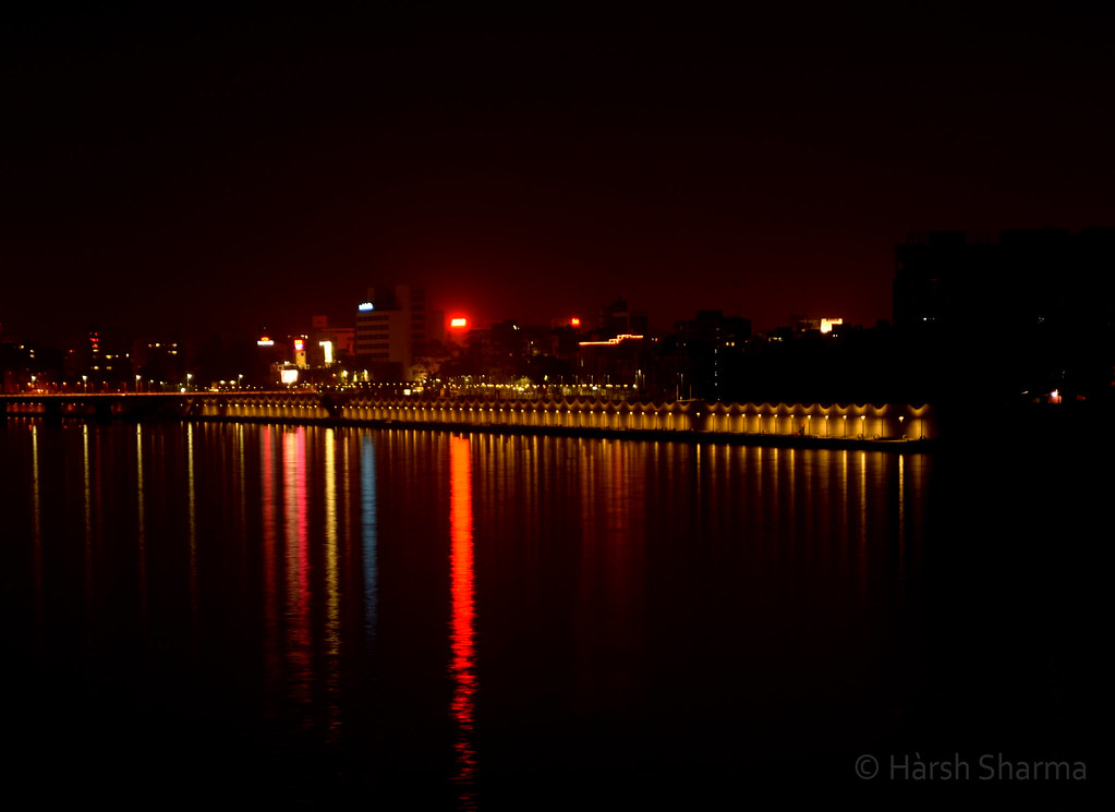 Ahmedabad’s cityscape with a mix of historic architecture and modern buildings, symbolizing the city’s rich cultural heritage and thriving academic institutions.